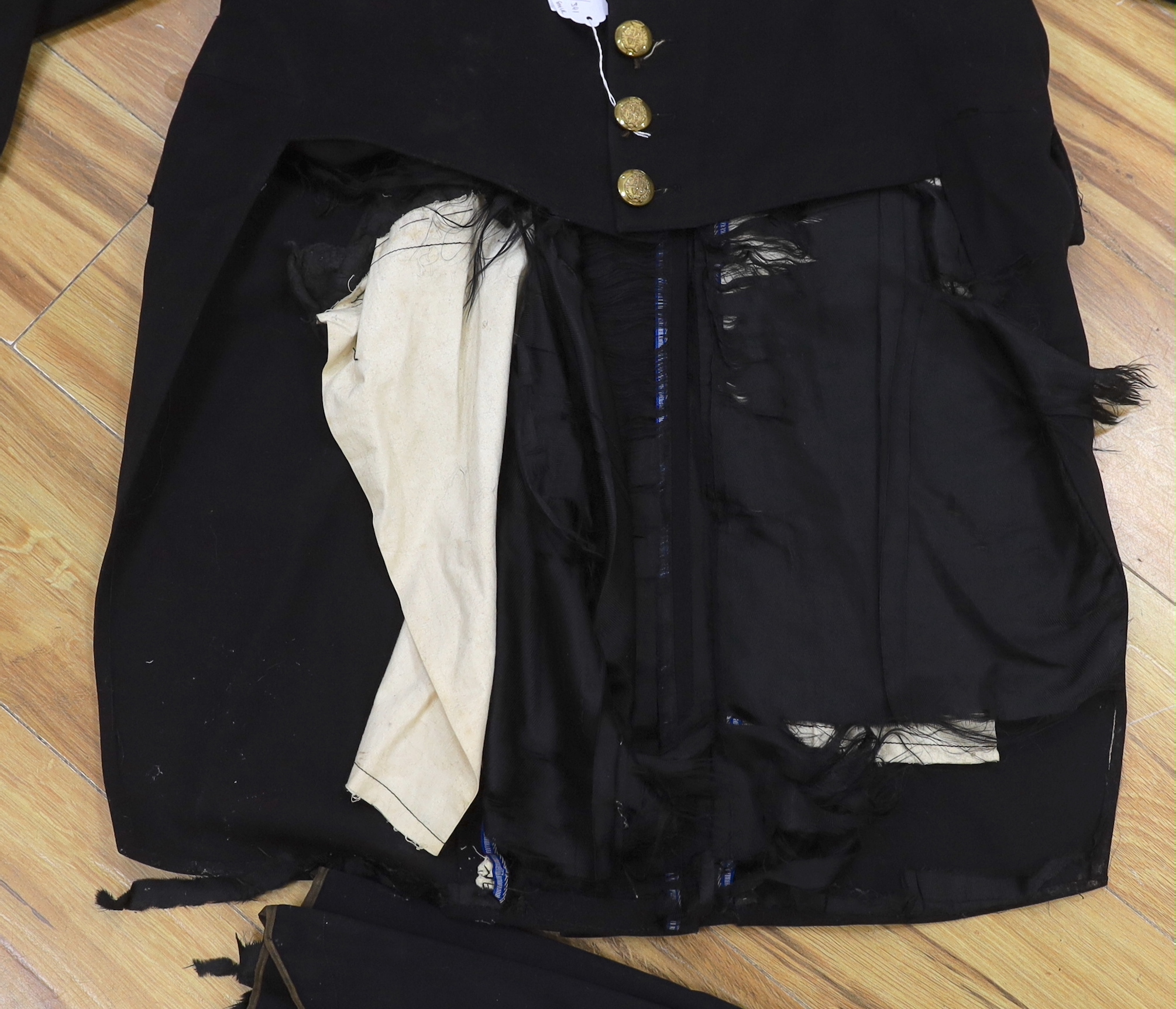 A military black wool dress uniform, with gold decorative braiding